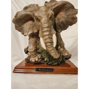 A. Belcari Sculpture of a Majestic Elephant, Featured on a Wood Stand